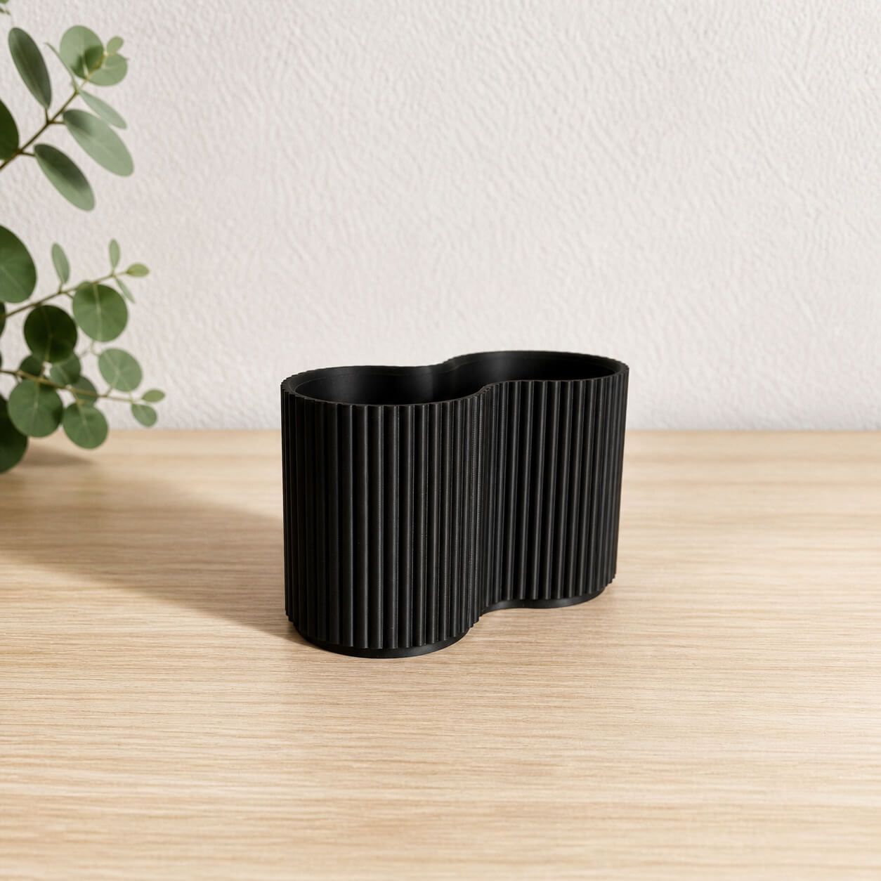 Black modular 3D-printed storage set for bathroom essentials